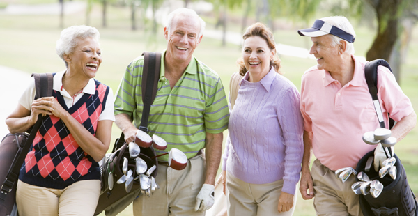 Portrait Of Four Friends Enjoying A Game Golf